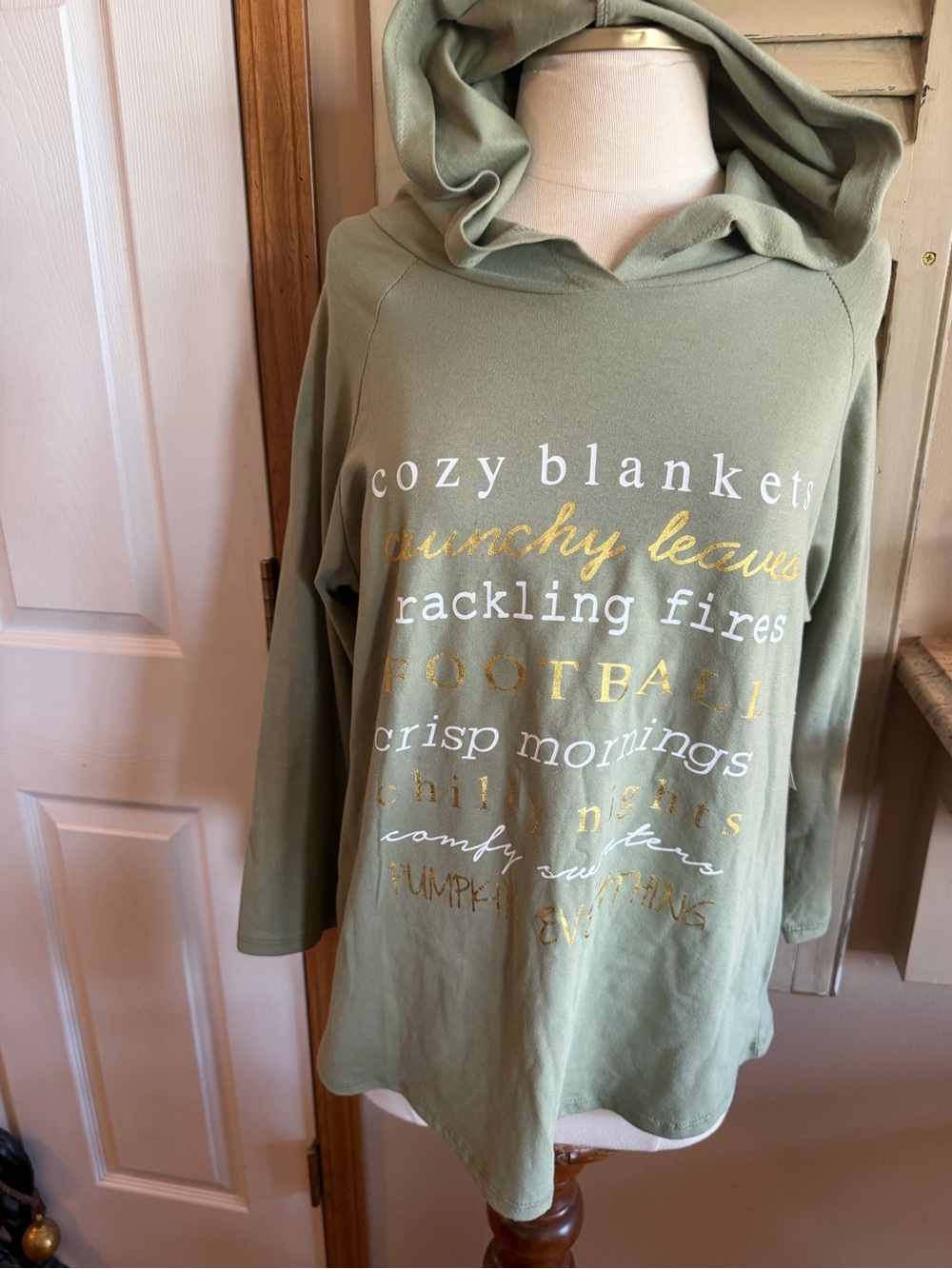 Cato Sage Green Graphic Hoodie Sweatshirt with Gold and White Text